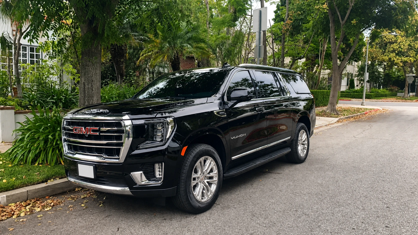 Real Gate and Mile GMC Yukon Denali parked curbside for Ontario Airport car service